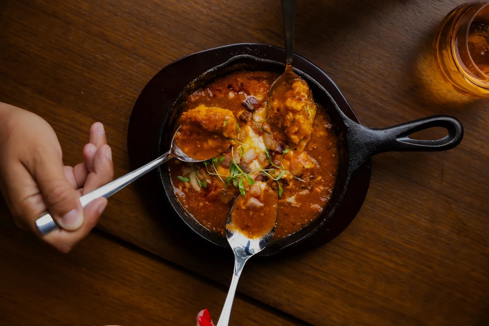 A savory skillet breakfast shared at the table at Cotidiano