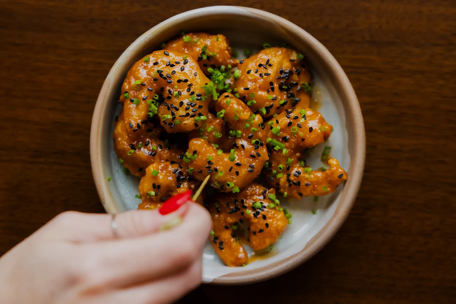 Rock shrimp with sriracha-ponzu aioli, black sesame, and chives
