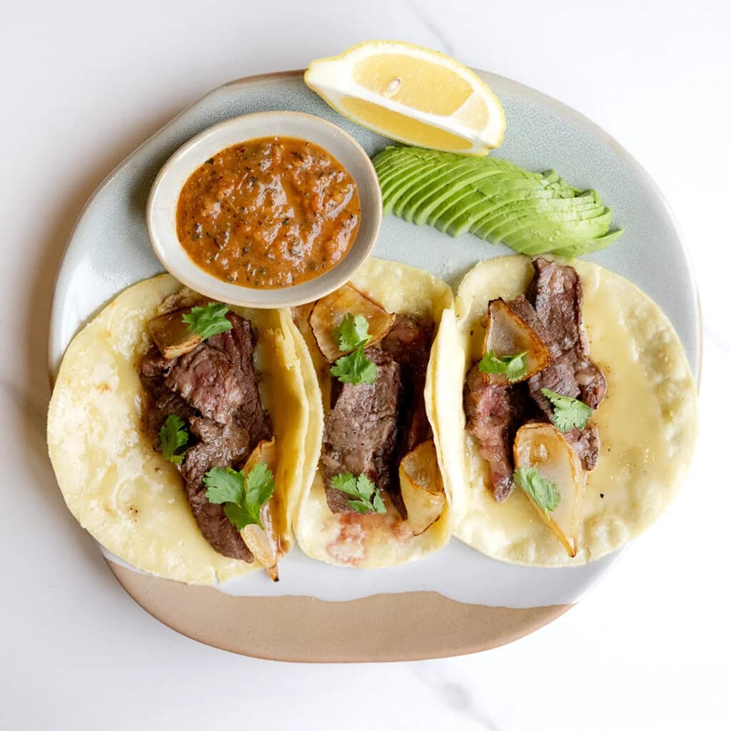 Skirt steak tacos with avocado, lemon, and salsa