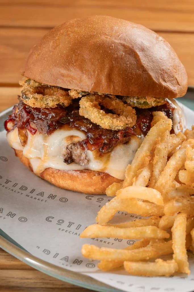 Cotidiano's sirloin burger with melted cheese, bacon jam and crispy jalapenos